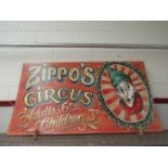 A large 'Zippos Circus' advertising sign,