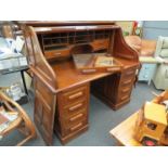 An early 20th Century roll-top desk for restoration, 130cm tall, 85cm deep,