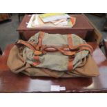 Two holdalls including a canvas example and a whip