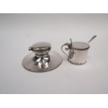A silver capstan inkwell with no liner and a silver mustard with spoon
