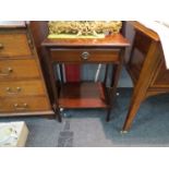 A mahogany single drawer bedside table with undertier, ring handle.