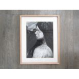 FRANCES MARTIN (Contemporary Norwich artist): A framed and glazed charcoal on paper portrait of a