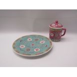 A modern Chinese longevity plate in blues and pink design together with a Chinese lidded mug with