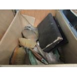 A box containing dressing table set and part sets including a silver backed brush and mirror