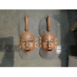 Two African carved hardwood wall masks