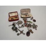 A quantity of bijouterie including silver marked pendants, brooches,