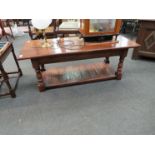 A rectangular oak coffee table with undertier