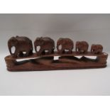A wooden carving of elephant family,