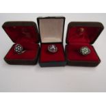 Three cased silver rings,