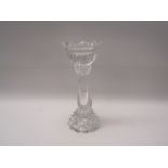 A heavy glass candlestick,