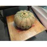 A terracotta pumpkin lantern with removeable top,