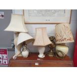 A brass oil lamp and four other lamps and shades (5)