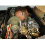 A box of bygones including oil lamps and copper warmer