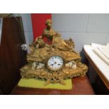 A 19th Century gilt spelter mantel clock, the top surmounted by a maiden over a Naval design base,
