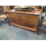 A South African hardwood chest, fold design front and sides, with heavy textured brass fittings,