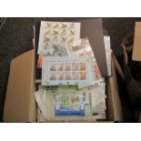 A box containing a large collection of mint stamps including Jersey and marine mammals