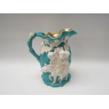 A large Parian ware jug with figural scenes by grapevines, gilt rim interior,
