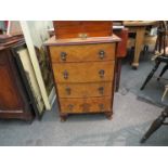 A 1930's burr walnut bow fronted slim chest of four drawers, droplet handles,