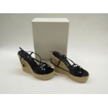 A pair of YSL stylish wedges with navy straps,