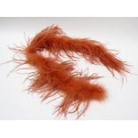 A 1960's deep apricot feather stole