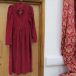 A Laura Ashley fine needle cord dress in red with a blue leaf style pattern,