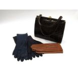 A brown crocodile vintage handbag together with five pairs of kid leather gloves, tan,