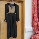 A black rayon and velvet 1970's hippy chic dress made in Afghanistan,