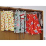 Four skirts including a wonderful toy soldier nursery print cotton skirt with a faux toy drum