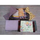 An assortment of vintage fabrics including checks,
