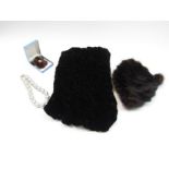 A 1950's mink fur hat, black rouched velvet stole, mink brooch and earrings set,