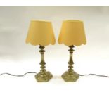 A pair of French brass table lamps with deep cream scalloped shades