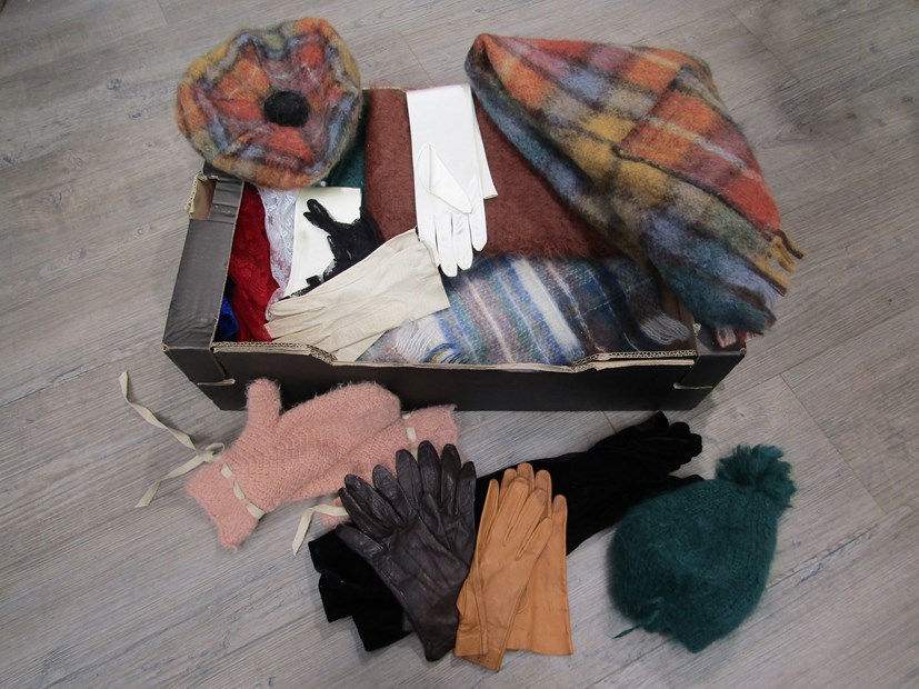 A box containing mohair scarves,