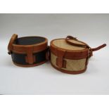 Two rigid barrel shaped handbags in leather and rattan both made Indonesia