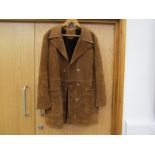 A 1970's tan faux suede car coat with a brown faux fur lining