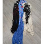 Three silk embroidered shawls in peacock blue, black and red, black and cream,
