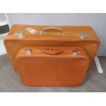 Two tan coloured pig skin suitcases of graduated size, purchased from Harrods circa 1940's,