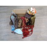 A box of vintage hats and scarves and tassels