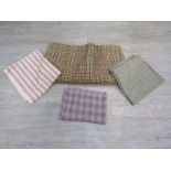 An assortment of vintage tweeds, check and stripe woolen fabrics.