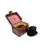 A black top hat by makers Woodrow,