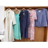 Five items of iconic Laura Ashley clothing to include three dresses,