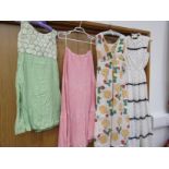 Four items of middle 20th Century ladies clothing including a pink and white gingham pleated long