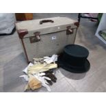 A Wegener green top hat box with a selection of linen and gloves,