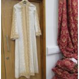 An Eastern floral full length gents tunic in cream with elaborate pale gold embroidery,