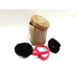 A box of three vintage hats including stylish black velvet "S" shaped skull cap with red velvet hat