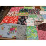 A suitcase containing a considerable quantity of dress and clothing prints,