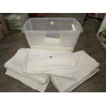 A large lidded storage box containing five Cowdray Park linen damask banqueting cloths in a