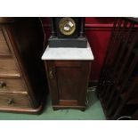 An Edwardian mahogany marble top night cabinet with single door and shaped apron,