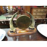 An early 20th Century cow horn and oak dinner gong,