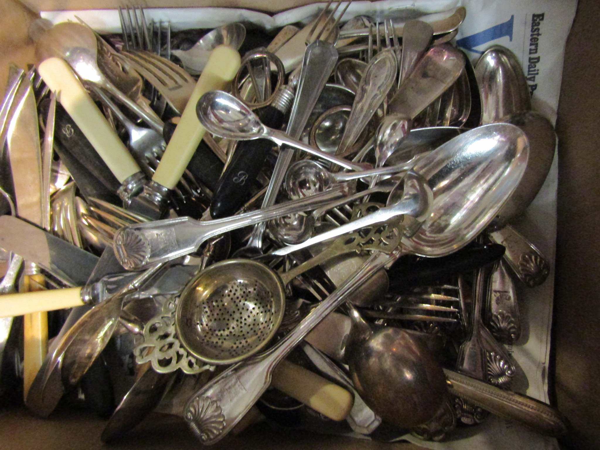 A collection of cutlery including flatware