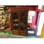 A 19th Century mahogany astragal glazed two door bookcase on two door cupboard base with adjustable